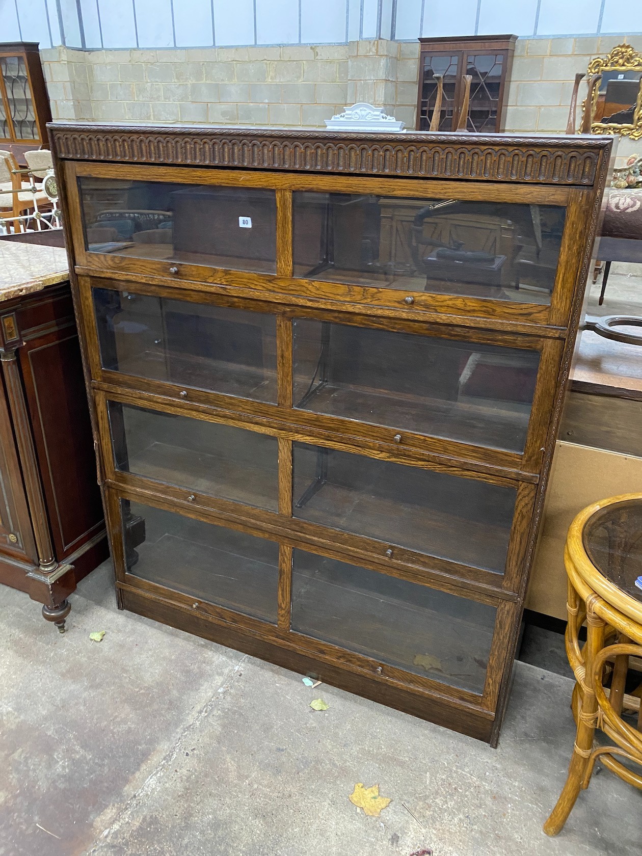A Globe Wernicke style glazed oak two section bookcase, width 130cm, depth 29cm, height 154cm